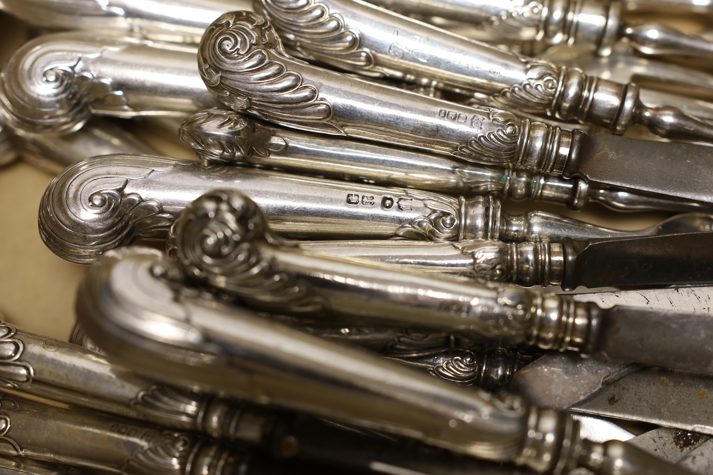 Four Victorian silver pistol handled dessert forks and five matching knives, Goldsmiths & Silversmiths Co Ltd, Sheffield, 1882, knife 21.6cm, together with six late Victorian matched silver pistol handled steel tea forks